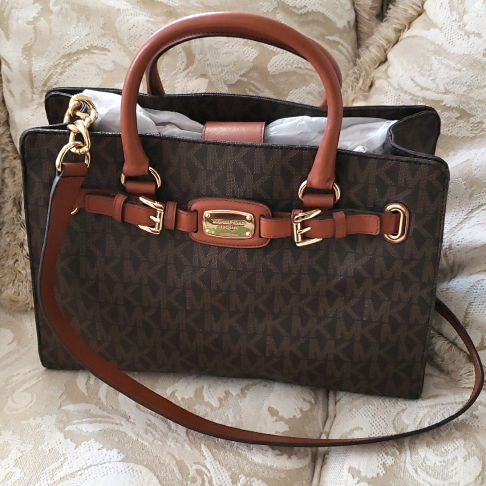 Michael Kors handbag. NWT. 15"w x 11 3/4" has handles and shoulder strap.$100